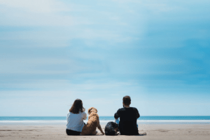 couple-and-dog-at-beach